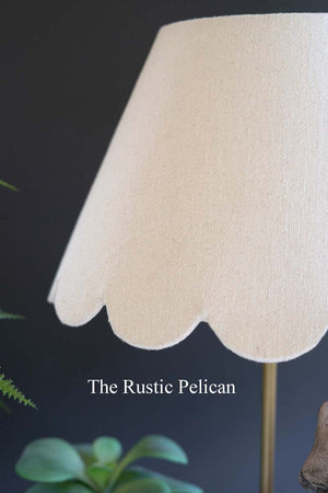 Table lamp with wooden rabbit and scalloped fabric shade