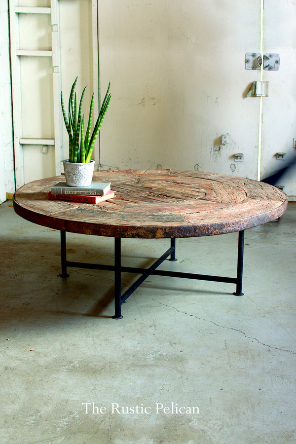 Rustic coffee table made of a reclaimed wood wagon wheel