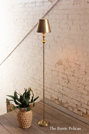 tall modern stylish gold lamp with a beautiful gold shade 